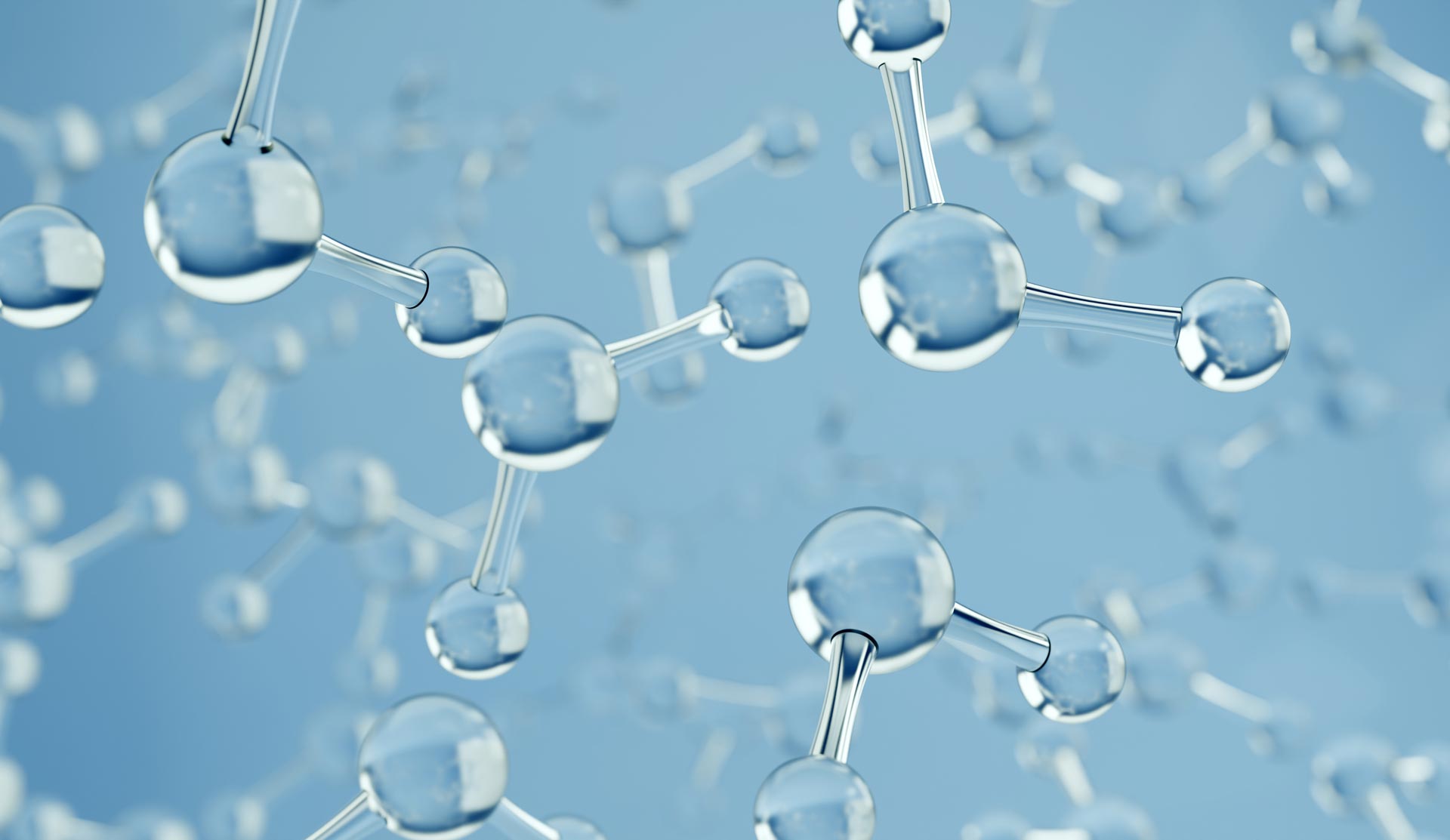 A collection of water molecules set on a blue background.