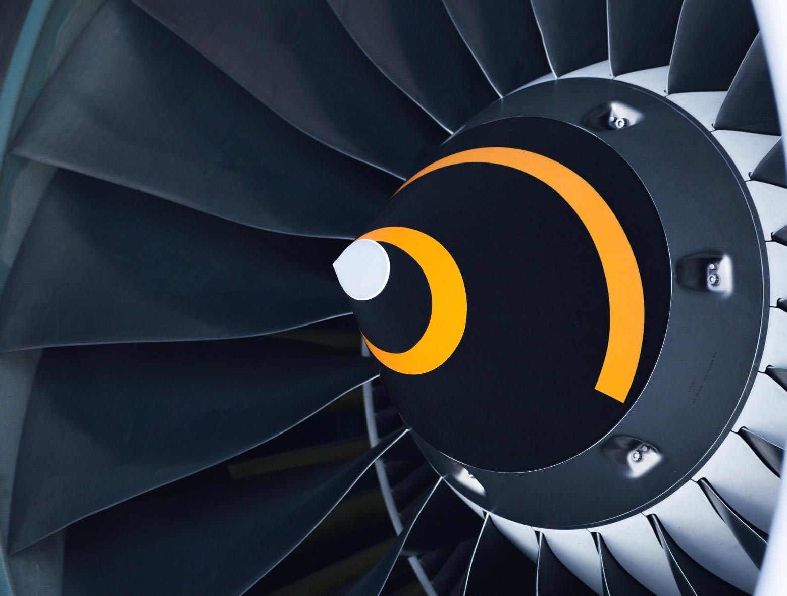 A close-up of a jet engine featuring a yellow and black circle.